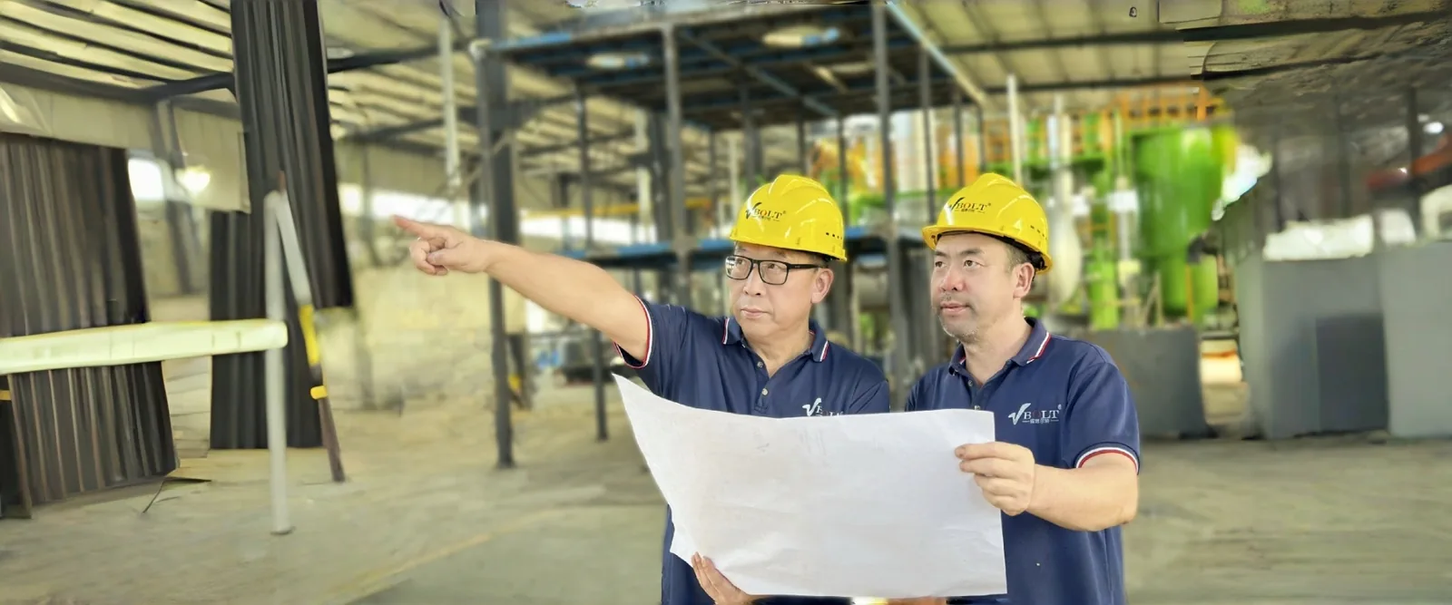 VBOLT engineers reviewing drawings on a project site